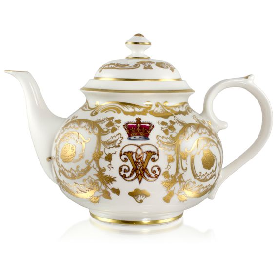 Victoria and Albert English fine bone china teapot featuring the ciphers of Queen Victoria and Prince Albert surmounted by a royal crown and surrounded by intricately ornated gold patterns. Victoria and Albert English fine bone china teapot featuring the ciphers of Queen Victoria and Prince Albert surmounted by a royal crown and surrounded by intricately ornated gold patterns.