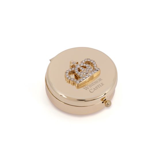 Gold compact mirror with bejewelled crown on top. Windsor Castle etched below. Gold compact mirror with bejewelled crown on top. Windsor Castle etched below.