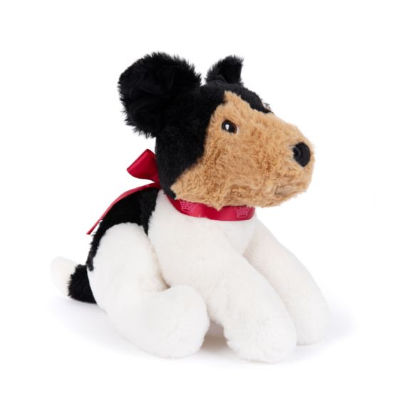 dog soft toy with brown soft face and black ears. Red satin bow with details of crowns dog soft toy with brown soft face and black ears. Red satin bow with details of crowns
