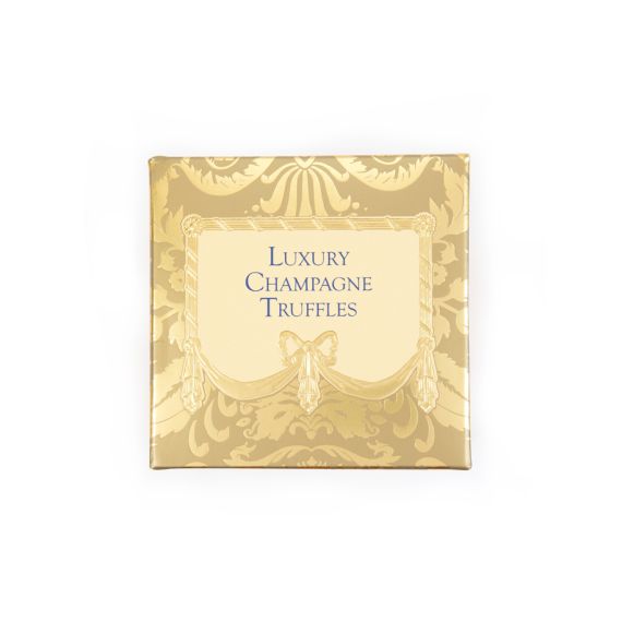 A golden patterned box with light yellow centre, featuring "Luxury Champagne Truffles" written in centre in blue text. A golden patterned box with light yellow centre, featuring "Luxury Champagne Truffles" written in centre in blue text.