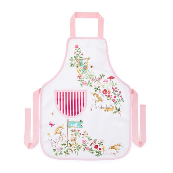 The Children's Unicorn Apron, featuring the new designs with unicorns in a wild meadow against a white backdrop. The illustration features unicorns amongst wildflowers with flags and woodland creatures. The front pocket features a white and red strip wit The Children's Unicorn Apron, featuring the new designs with unicorns in a wild meadow against a white backdrop. The illustration features unicorns amongst wildflowers with flags and woodland creatures. The front pocket features a white and red strip wit